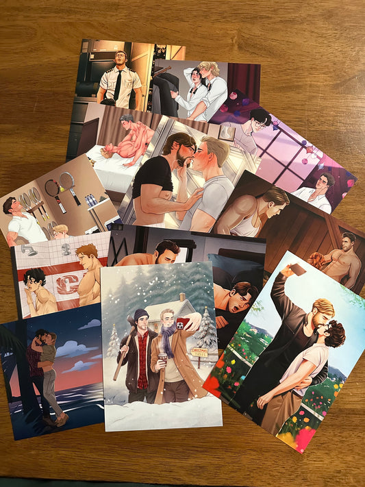 Collection of postcards featuring various scenes on a wooden surface